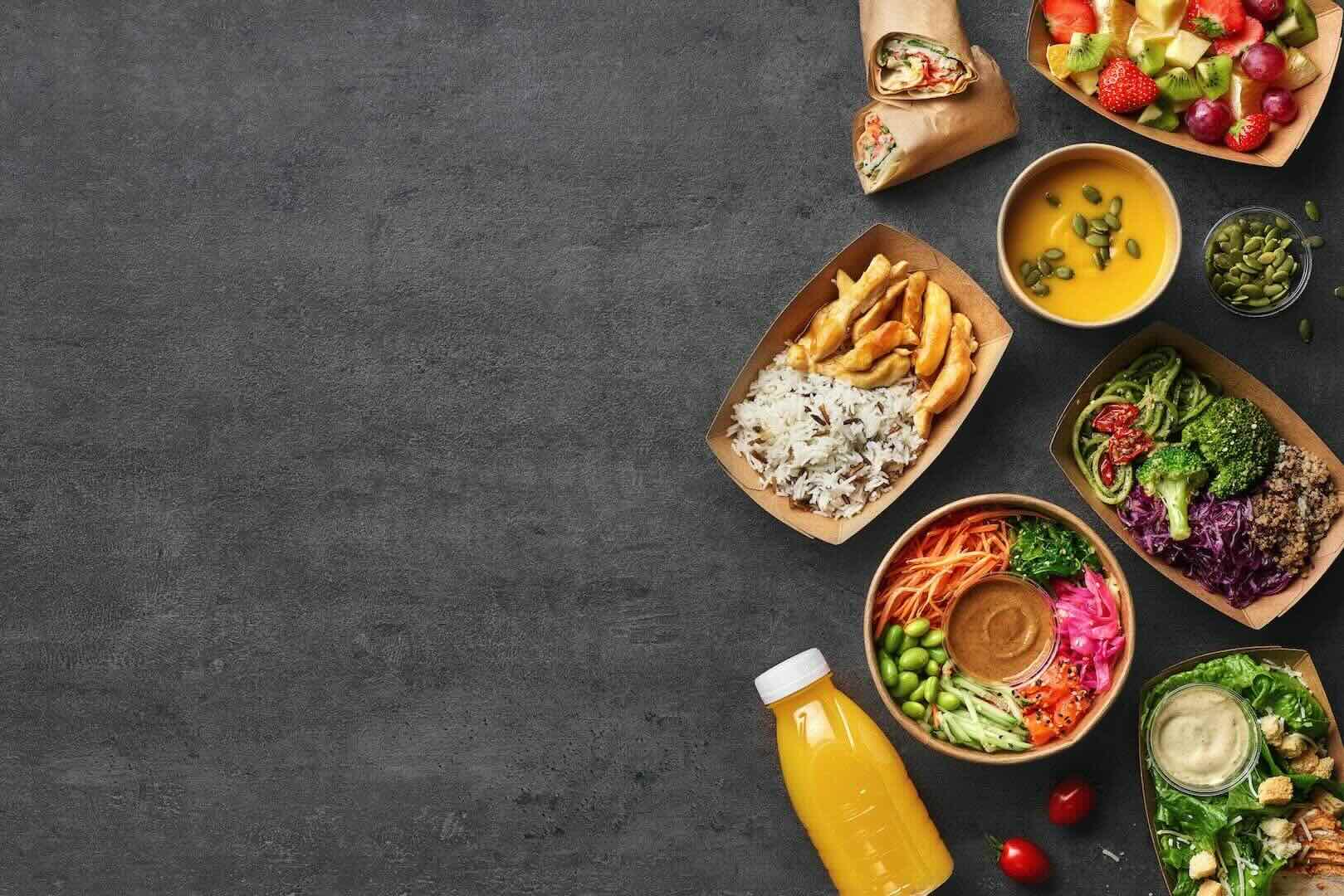 Various healthy food plates, including vegetables, rice, chicken, and a bottle of fruit juice